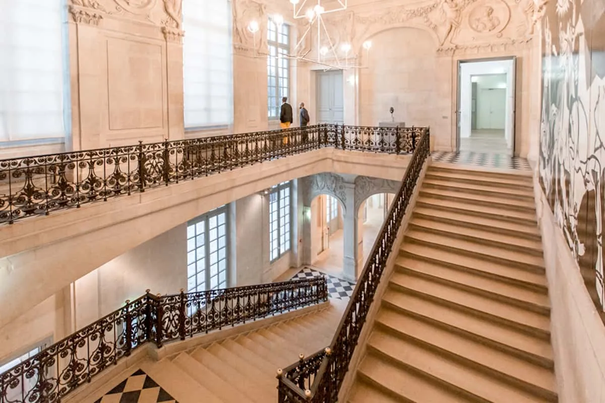 Grand staircase of the Hotel Sale housing the Picasso Museum, a standout museum in Paris