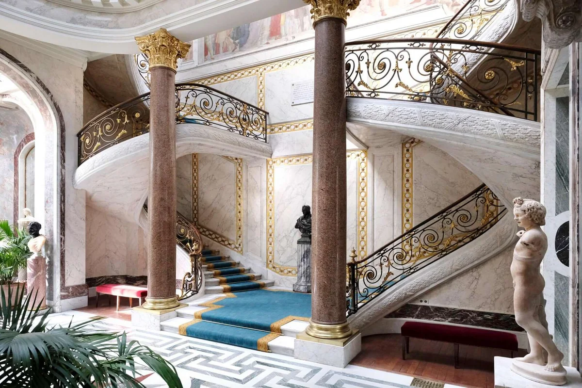 The gilded double staircase of the Musée Jacquemart-André mansion, a hidden gem among museums in Paris