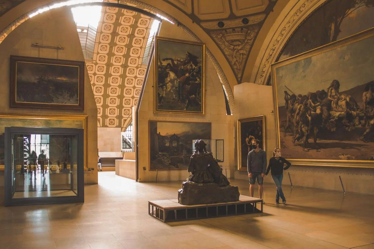 Sculpture and painting galleries under the vaulted roof of the Musée d'Orsay, a top museum in Paris