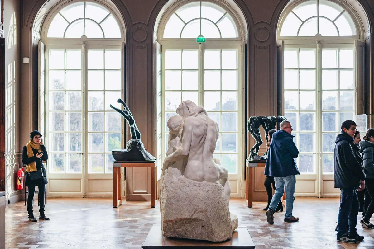 Rodin's The Kiss in marble in a light-filled gallery of the Hôtel Biron, a favourite among museums in Paris